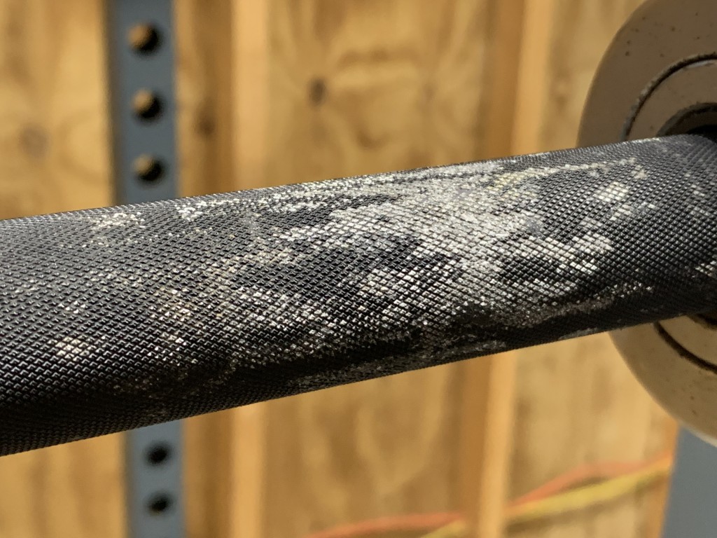 Black oxide coating wearing off barbell from UHMW J hooks
