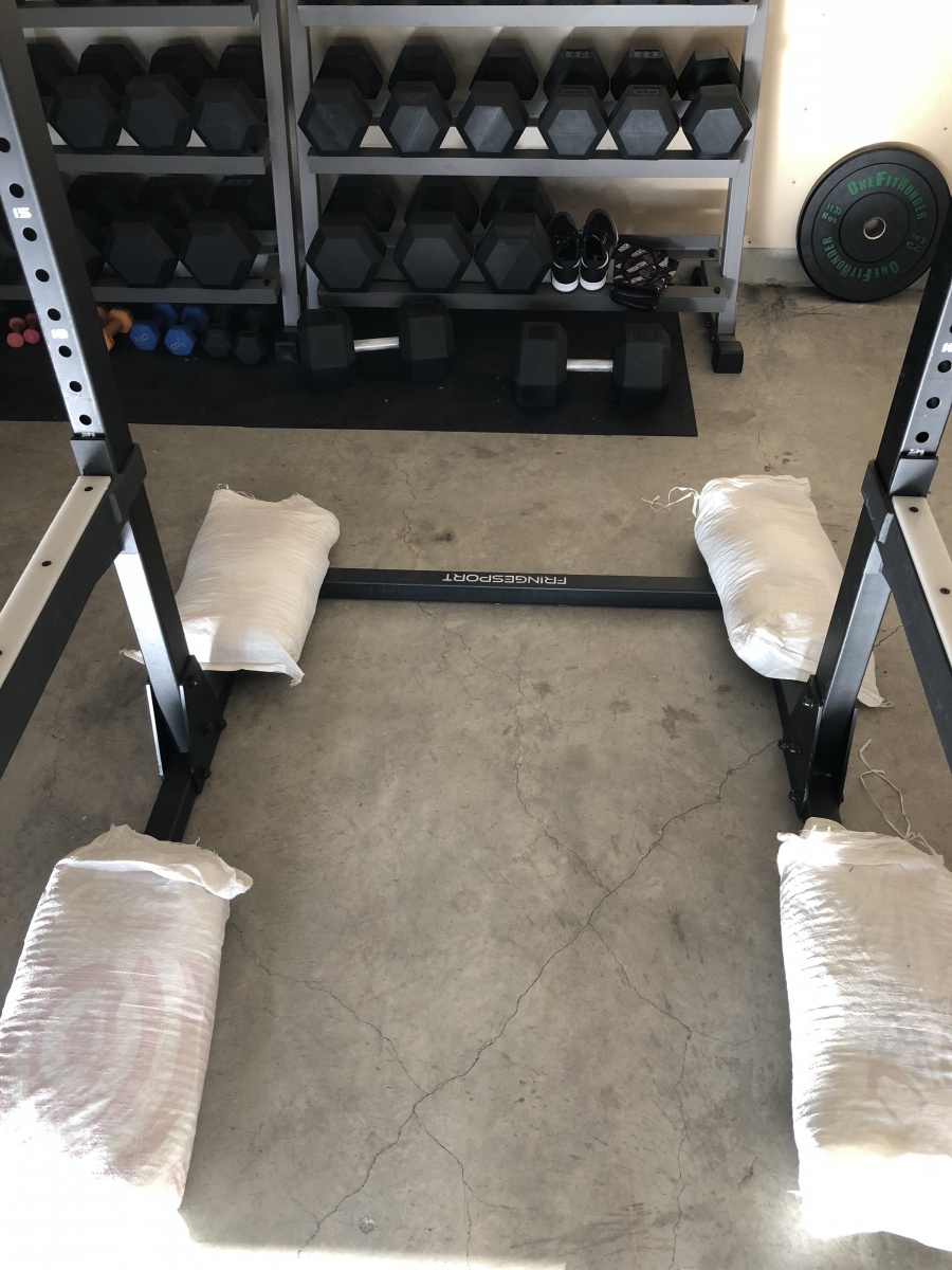 sandbags to weigh down commercial squat rack