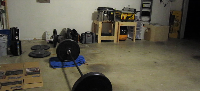 Troy bar and VTX bumper plates, using towels and cardboard as a platform