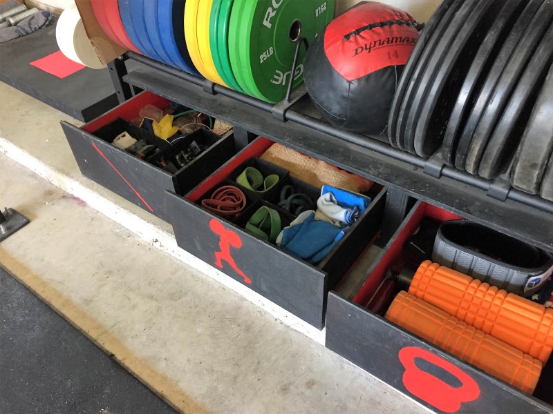 A chest of drawers to store workout accessories