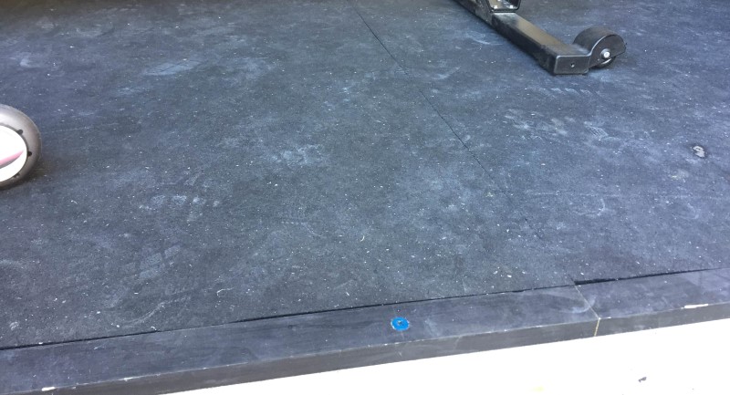 2x1 boards to keep stall mats from sliding in garage gym