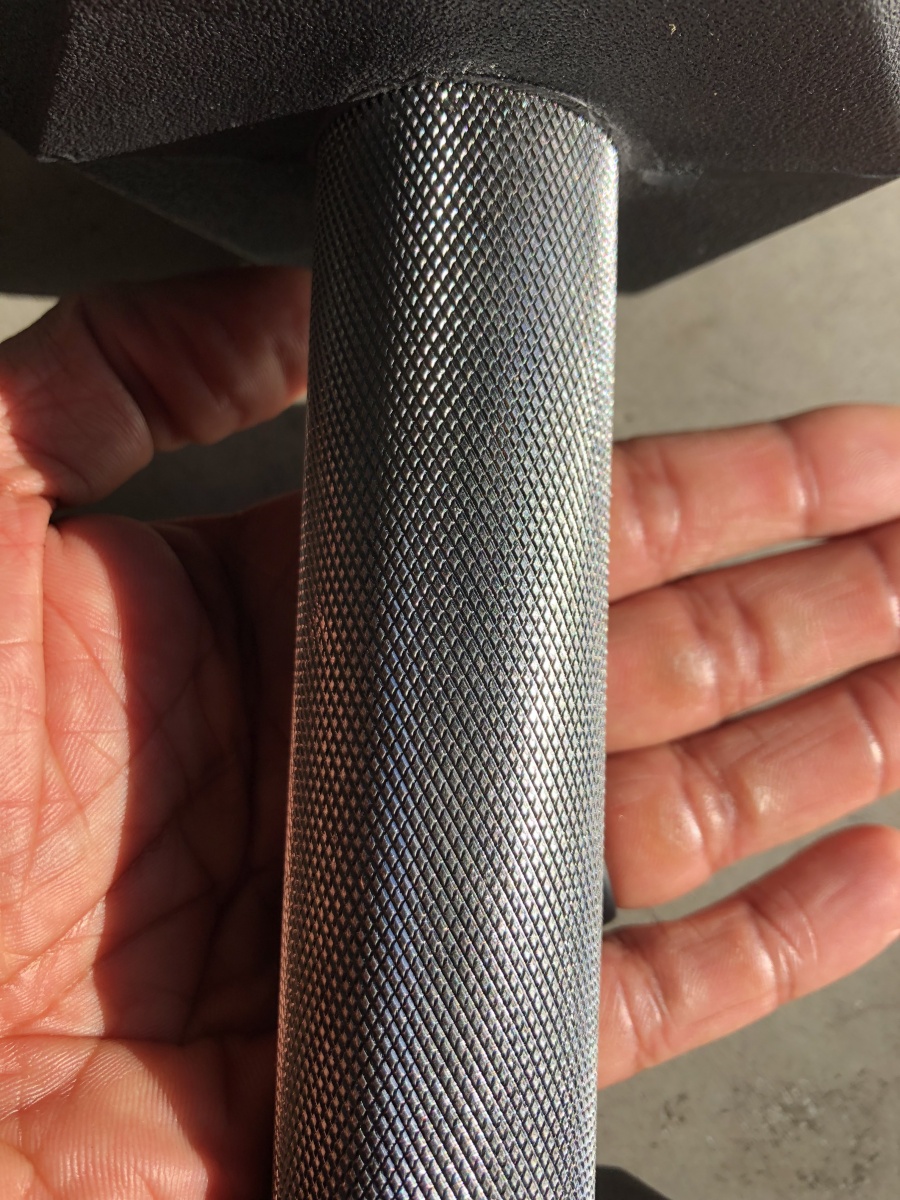 knurling of Rep rubber hex dumbbells