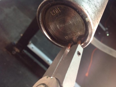 Removing snap ring on olympic barbell with pliers