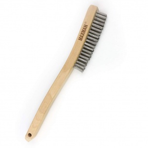 stainless steel hand brush for cleaning a rusty barbell