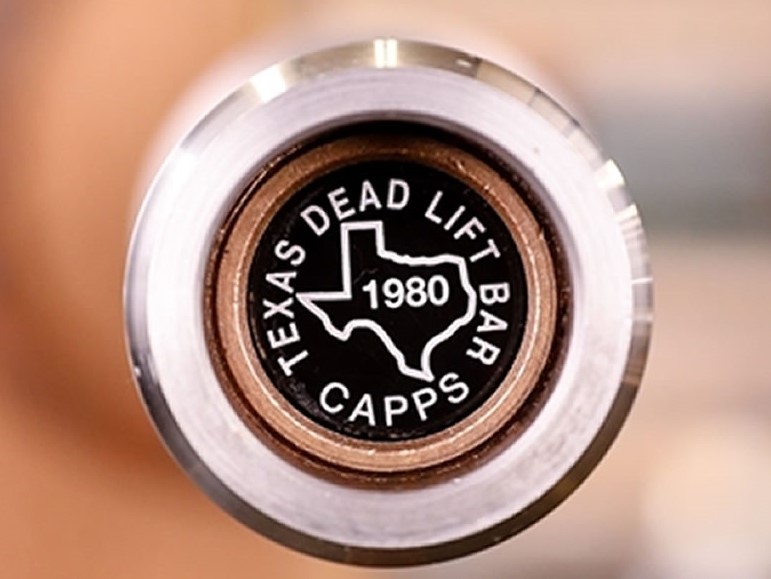 Texas Deadlift Bar end cap with state of Texas logo